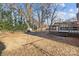 Large backyard with mature trees and a deck at 2810 Daleview Dr, Charlotte, NC 28214