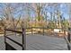 Back deck with wooden railings and tree view at 2810 Daleview Dr, Charlotte, NC 28214