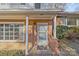 Front entrance with brick columns and storm door at 2810 Daleview Dr, Charlotte, NC 28214