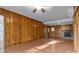 Living room with wood paneled walls and hardwood floors at 2810 Daleview Dr, Charlotte, NC 28214