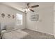 Cozy bedroom with a floral-patterned bed and ceiling fan at 372 Olympia Way, York, SC 29745