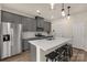 Stainless steel appliances and gray cabinetry in this kitchen at 372 Olympia Way, York, SC 29745