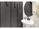 Modern powder room with pedestal sink and dark accent wall at 372 Olympia Way, York, SC 29745