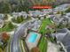 Aerial view showing home, pool, and community at 4919 Polo Gate Blvd, Charlotte, NC 28216