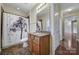 Bathroom offers a single sink, neutral tones, and a shower with a nature-themed curtain at 4919 Polo Gate Blvd, Charlotte, NC 28216