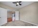 This bedroom's entry, visible hardwood floors, and connection to an outdoor space create a versatile and inviting living space at 4919 Polo Gate Blvd, Charlotte, NC 28216