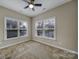 Spacious bedroom with neutral carpeting and multiple windows at 4919 Polo Gate Blvd, Charlotte, NC 28216