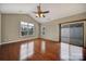 Bedroom with wood floors, neutral walls, and access to the patio at 4919 Polo Gate Blvd, Charlotte, NC 28216