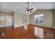 Bright, airy room with hardwood floors, a fan, and neutral paint at 4919 Polo Gate Blvd, Charlotte, NC 28216
