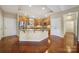 Open concept kitchen with granite island and hardwood floors at 4919 Polo Gate Blvd, Charlotte, NC 28216