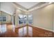 Sunlit room with hardwood floors and multiple windows at 4919 Polo Gate Blvd, Charlotte, NC 28216