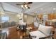 Open-concept living space with hardwood floors, ceiling fan, kitchen island and modern furnishings at 4919 Polo Gate Blvd, Charlotte, NC 28216