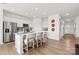 Stylish kitchen island with barstool seating and stainless steel appliances at 550 Mountain View Dr, Monroe, NC 28110