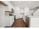 Well-lit kitchen showcasing quartz countertops, stainless steel appliances, and modern cabinetry at 550 Mountain View Dr, Monroe, NC 28110