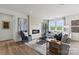 Bright living room featuring large windows, a modern fireplace, and hardwood floors at 550 Mountain View Dr, Monroe, NC 28110