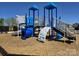 Community playground with slides, climbing wall, and tunnel, set on wood chip ground at 550 Mountain View Dr, Monroe, NC 28110