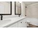 Modern bathroom with double vanity, white quartz countertop, and marble tile shower at 8001 Willhill Rd, Charlotte, NC 28227