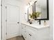 Double vanity bathroom with modern fixtures and white cabinets at 8001 Willhill Rd, Charlotte, NC 28227