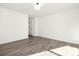 Spacious bedroom with wood-look floors and door at 8001 Willhill Rd, Charlotte, NC 28227