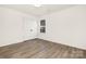 Bright bedroom with wood-look floors and double doors at 8001 Willhill Rd, Charlotte, NC 28227