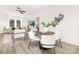 Modern dining area with white chairs and a wood table at 8001 Willhill Rd, Charlotte, NC 28227