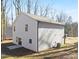 Gray house exterior with black windows and a small patio at 8001 Willhill Rd, Charlotte, NC 28227