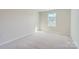 Bright bedroom with neutral walls and carpet at 9744 Inkberry Dr, Gastonia, NC 28056