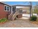 Brick home with covered patio and stairs at 107 N Thompson St, Shelby, NC 28150