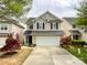 Charming two-story home featuring a two-car garage and well-maintained landscaping with beautiful red Japanese maple at 1096 Mountain Laurel Ct, Matthews, NC 28104