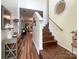 Inviting foyer with hardwood floors, staircase, high ceilings, decorative accents and seamless access to the living spaces at 1096 Mountain Laurel Ct, Matthews, NC 28104