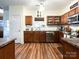 Functional kitchen layout featuring stainless steel appliances, hardwood floors, and ample counter space for meal preparation at 1096 Mountain Laurel Ct, Matthews, NC 28104