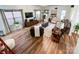 Spacious living room featuring hardwood floors, large windows, recessed lighting, and a comfortable seating arrangement at 1096 Mountain Laurel Ct, Matthews, NC 28104