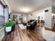Spacious living room with hardwood floors, neutral paint, recessed lighting, and seamless access to the dining area at 1096 Mountain Laurel Ct, Matthews, NC 28104