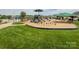 Community playground with slides, climbing structures, and green space at 1096 Mountain Laurel Ct, Matthews, NC 28104