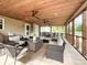 Cozy screened porch with multiple seating areas, perfect for relaxing at 1096 Mountain Laurel Ct, Matthews, NC 28104