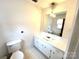 Clean bathroom with vanity, mirror, and toilet at 198 Dunlap Loop, Statesville, NC 28625