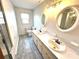 Bathroom with double vanity, large mirror, and updated shower at 198 Dunlap Loop, Statesville, NC 28625