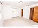Bright bedroom with carpet, window, and double door closet at 198 Dunlap Loop, Statesville, NC 28625