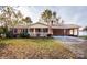Brick ranch house with carport and landscaped yard at 198 Dunlap Loop, Statesville, NC 28625