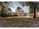 Brick ranch house with a covered porch and landscaped yard at 198 Dunlap Loop, Statesville, NC 28625