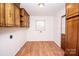 Laundry room with wood cabinets and vinyl flooring at 198 Dunlap Loop, Statesville, NC 28625