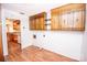 Laundry area with wood cabinets and access to kitchen at 198 Dunlap Loop, Statesville, NC 28625