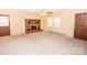 Living area with brick fireplace and built-in shelving at 198 Dunlap Loop, Statesville, NC 28625