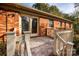 Back patio with brick house and white railing at 198 Dunlap Loop, Statesville, NC 28625