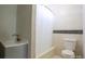 Clean bathroom with a toilet, bathtub, shower, and grey vanity at 3995 Burton Ln, Denver, NC 28037