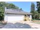 Newly renovated home with a large white garage door and steps leading to the front door at 3995 Burton Ln, Denver, NC 28037