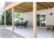 Covered patio with a table and chairs, offering an outdoor dining space at 3995 Burton Ln, Denver, NC 28037