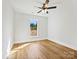 Bright bedroom features a large window and hardwood floors at 4539 Polk Ford Rd, Stanfield, NC 28163
