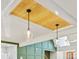 Unique ceiling design with wood paneling, modern lighting, and views of the staircase and living areas at 4539 Polk Ford Rd, Stanfield, NC 28163