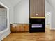 Cozy living room featuring a modern fireplace and built-in cabinets for stylish storage at 4539 Polk Ford Rd, Stanfield, NC 28163